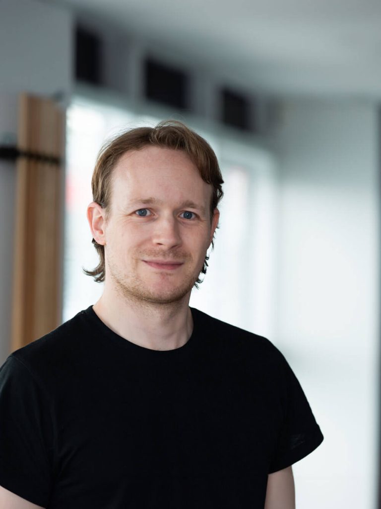 Portrait of a Resolute Cyber team member, Tim, against a plain white background.